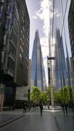 Modern buildings in city against sky