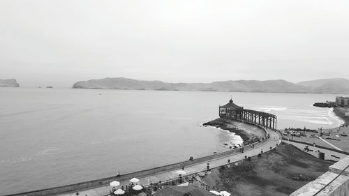 View of sea with buildings in background