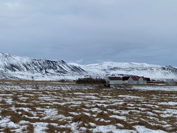 Scenic view of snow covered landscape against sky