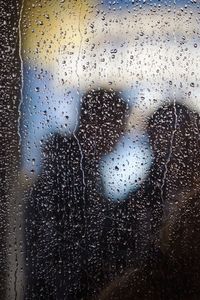 Full frame shot of raindrops on glass window