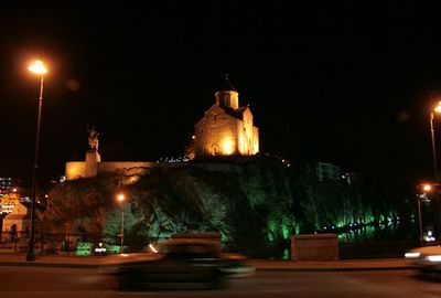 Illuminated street light at night