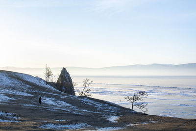 Scenic view of sea against sky during winter