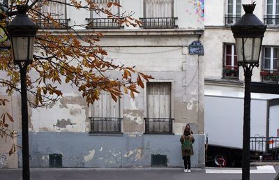 Woman in front of building