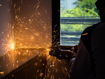 Close-up of man working at night