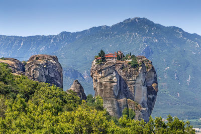 Panoramic view of rocks and plants against sky