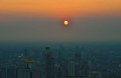 High angle view of buildings against sky during sunset