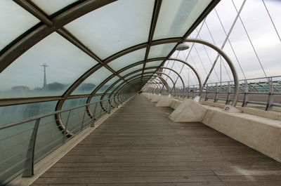 Bridge over footbridge against sky