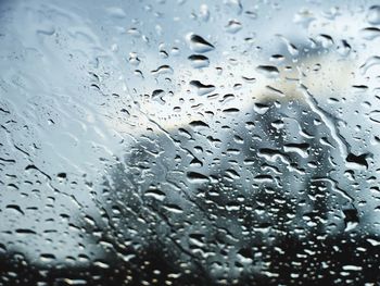 Full frame shot of raindrops on glass window