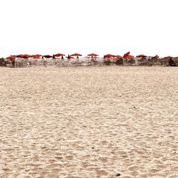 Scenic view of beach against clear sky