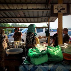 Rear view of people sitting at restaurant