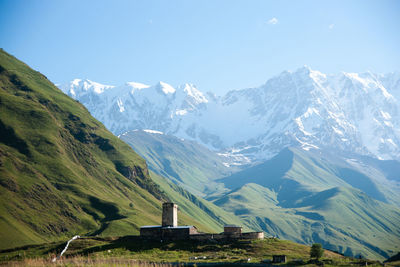 Scenic view of snowcapped mountains against sky