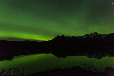 Scenic view of mountains against sky at night