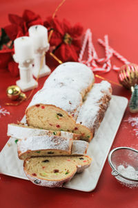 Christmas stollen on rustic background. traditional christmas festive pastry dessert