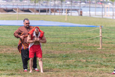 Full length of a man standing on field