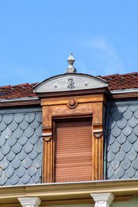 Low angle view of building against blue sky