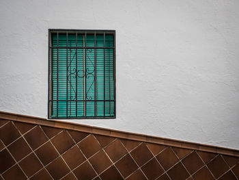 Low angle view of window on wall of building