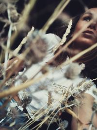 Close-up portrait of young woman looking away