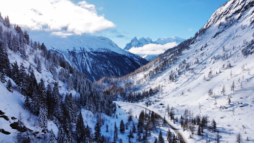 Scenic view of snowcapped mountains against sky