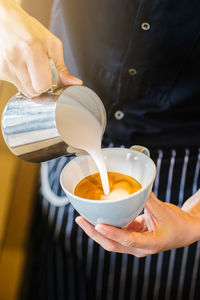 Hand holding coffee cup