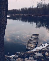 Scenic view of lake against sky during winter