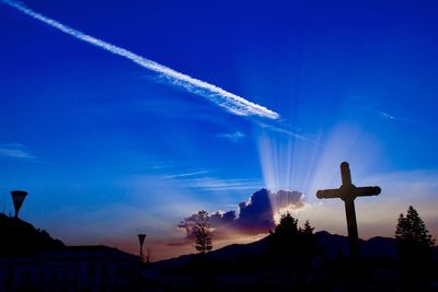 Low angle view of vapor trails in sky