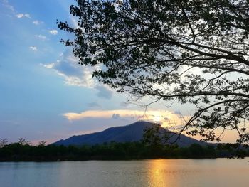 Scenic view of lake against sky during sunset