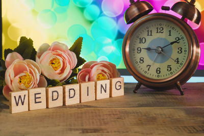 Close-up of clock on table