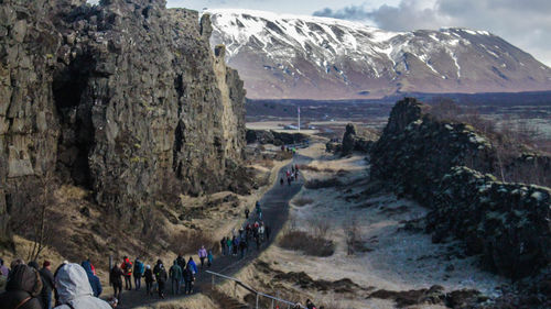 Group of people on snow covered mountain