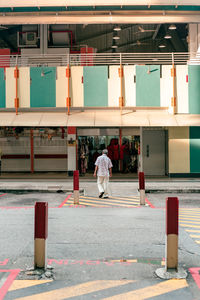 Rear view of people walking on street