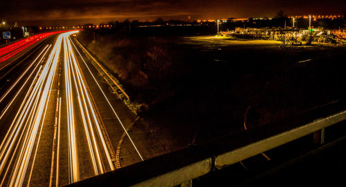 High angle view of light trails on road at night