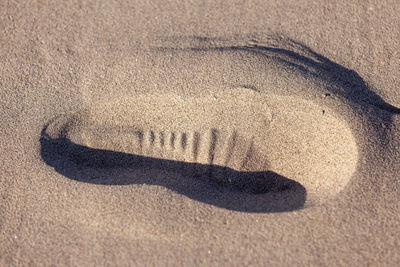 High angle view of heart shape on sand