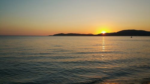 Scenic view of sunset over river