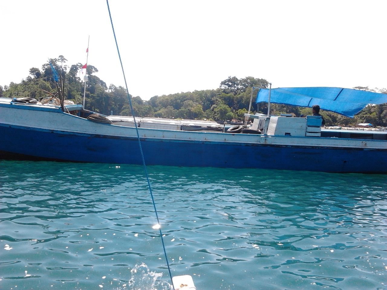 BOAT SAILING IN SEA