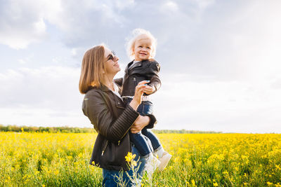 Mother and daughter on field