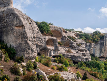 Scenic view of cliff against sky