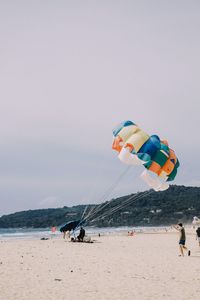 Full length of man walking at beach against sky