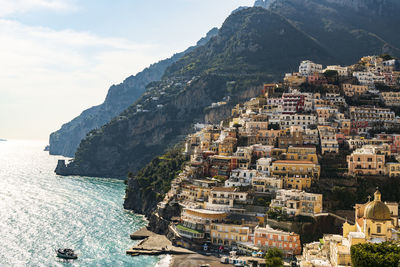 Aerial view of buildings by sea