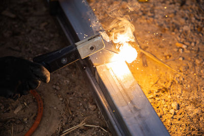 High angle view of man working on barbecue grill