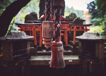 Close-up of bell hanging outside shrine