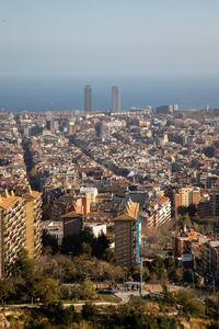 High angle view of buildings in city against sky