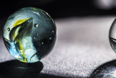 Close-up of crystal ball on table