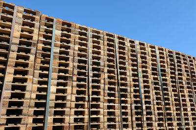 Low angle view of building against clear blue sky