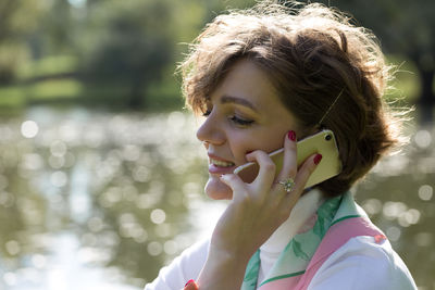 Close-up of young woman using mobile phone