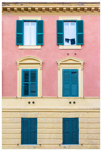 Clothes hanging in front of a window