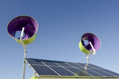 Solar panels against clear blue sky