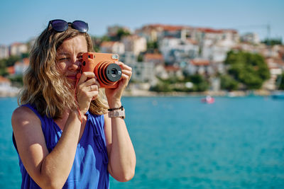 Woman photographing with camera