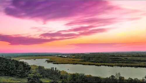 Scenic view of lake against sky during sunset