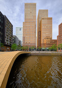 Amsterdam, netherlands - symphony building in zuidas. viewed from de boelgracht canal.