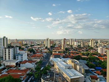 High angle view of buildings in city against sky