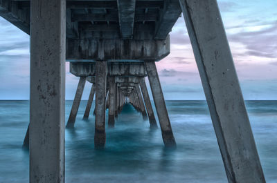 Pier on sea against sky